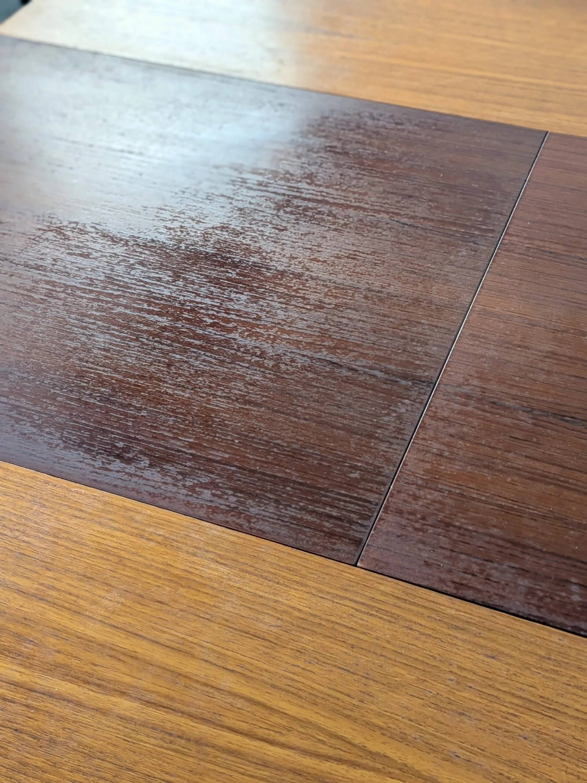 Round extendable wooden dining table