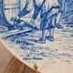 Old advertising plate with blue decoration after Teniers – 100,000 Shirts Paris