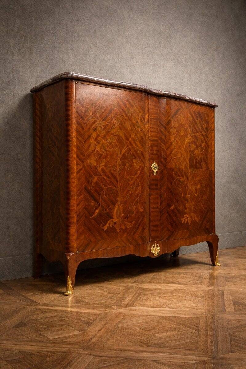 Wooden cabinet with doors, richly inlaid with floral patterns, Louis XV style.