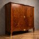 Wooden cabinet with doors, richly inlaid with floral patterns, Louis XV style.