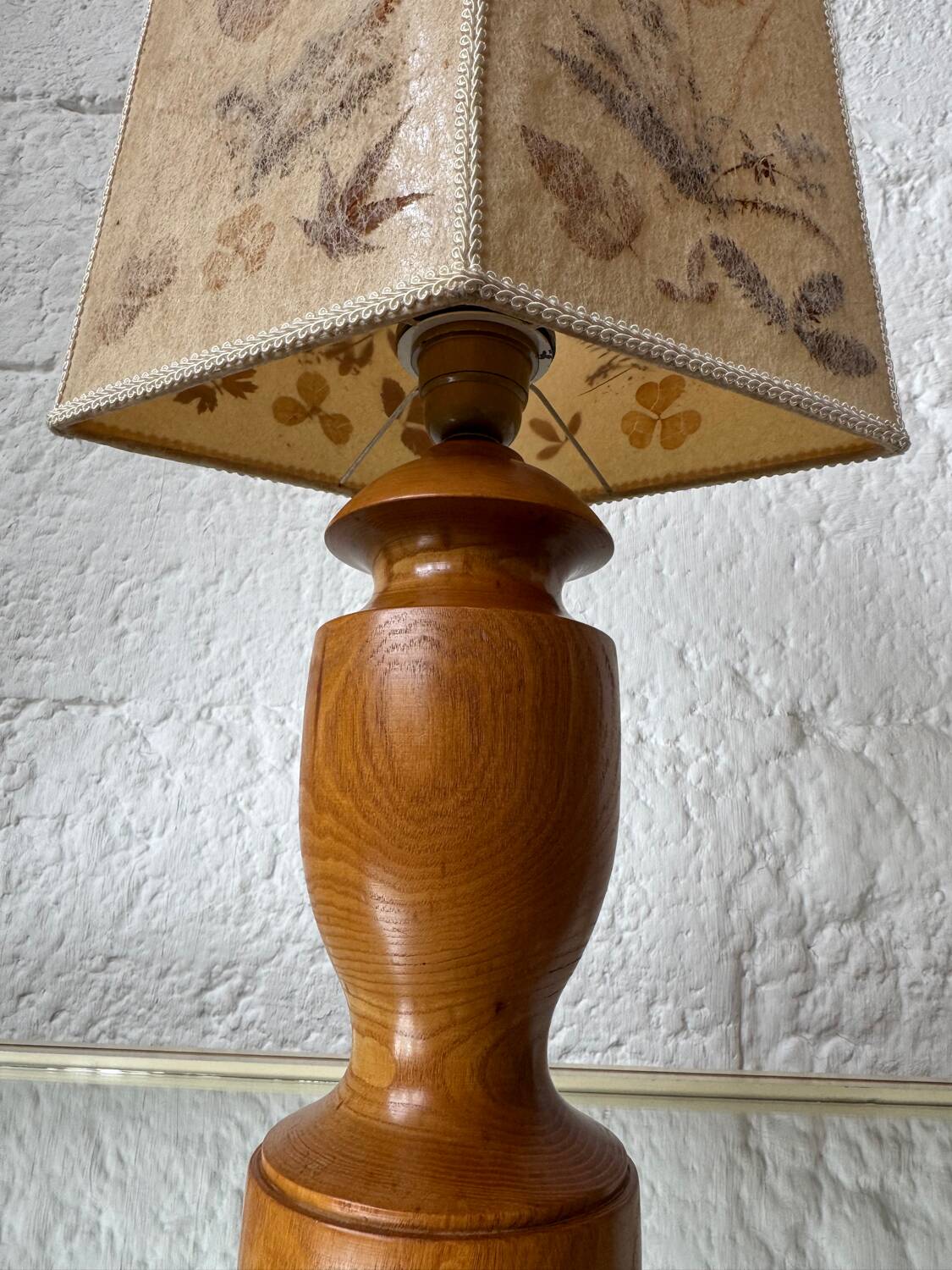 Turned wood lamp with a herbarium lampshade from the 1970s.