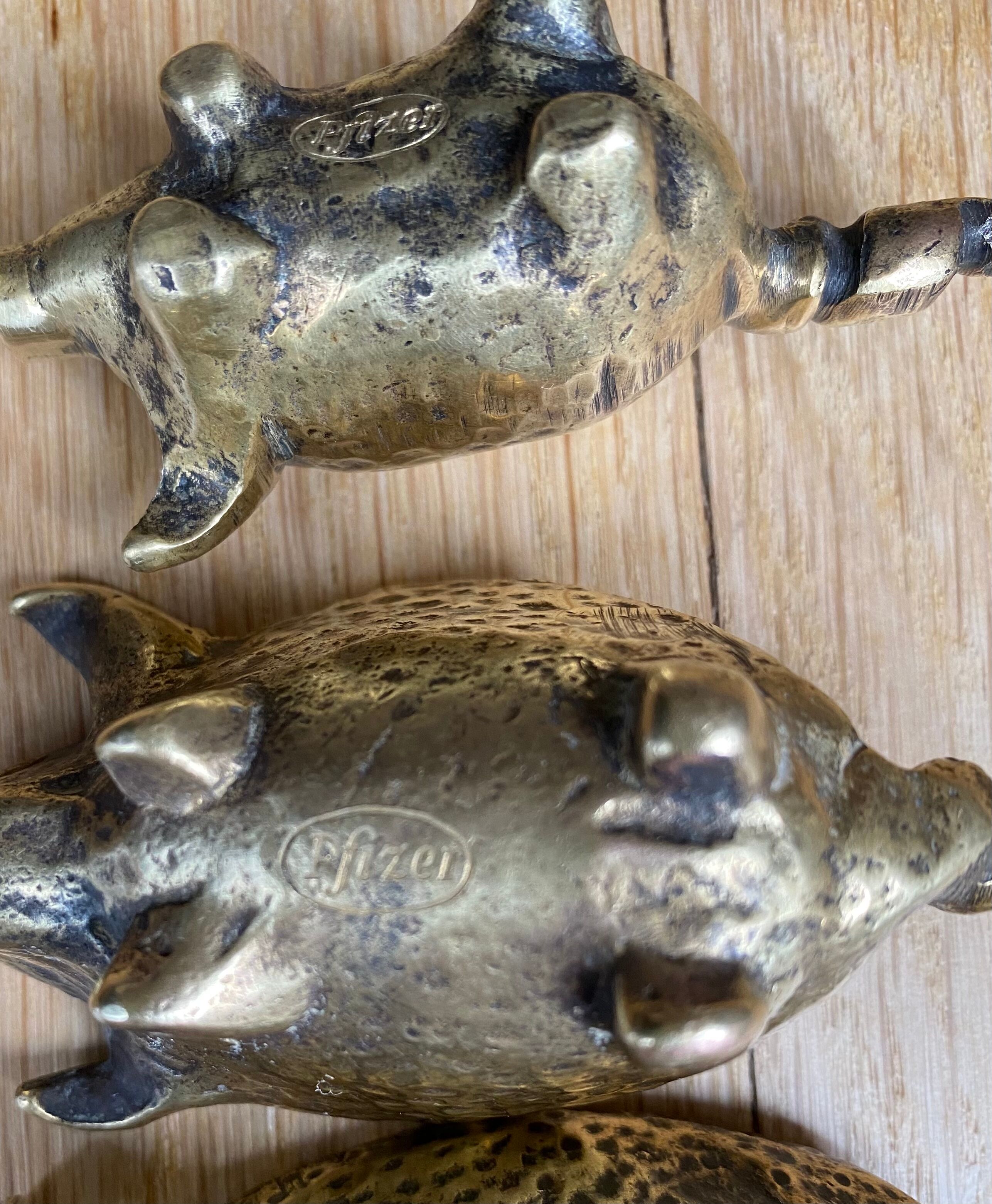 4 Pfizer bronze ashtray pigs