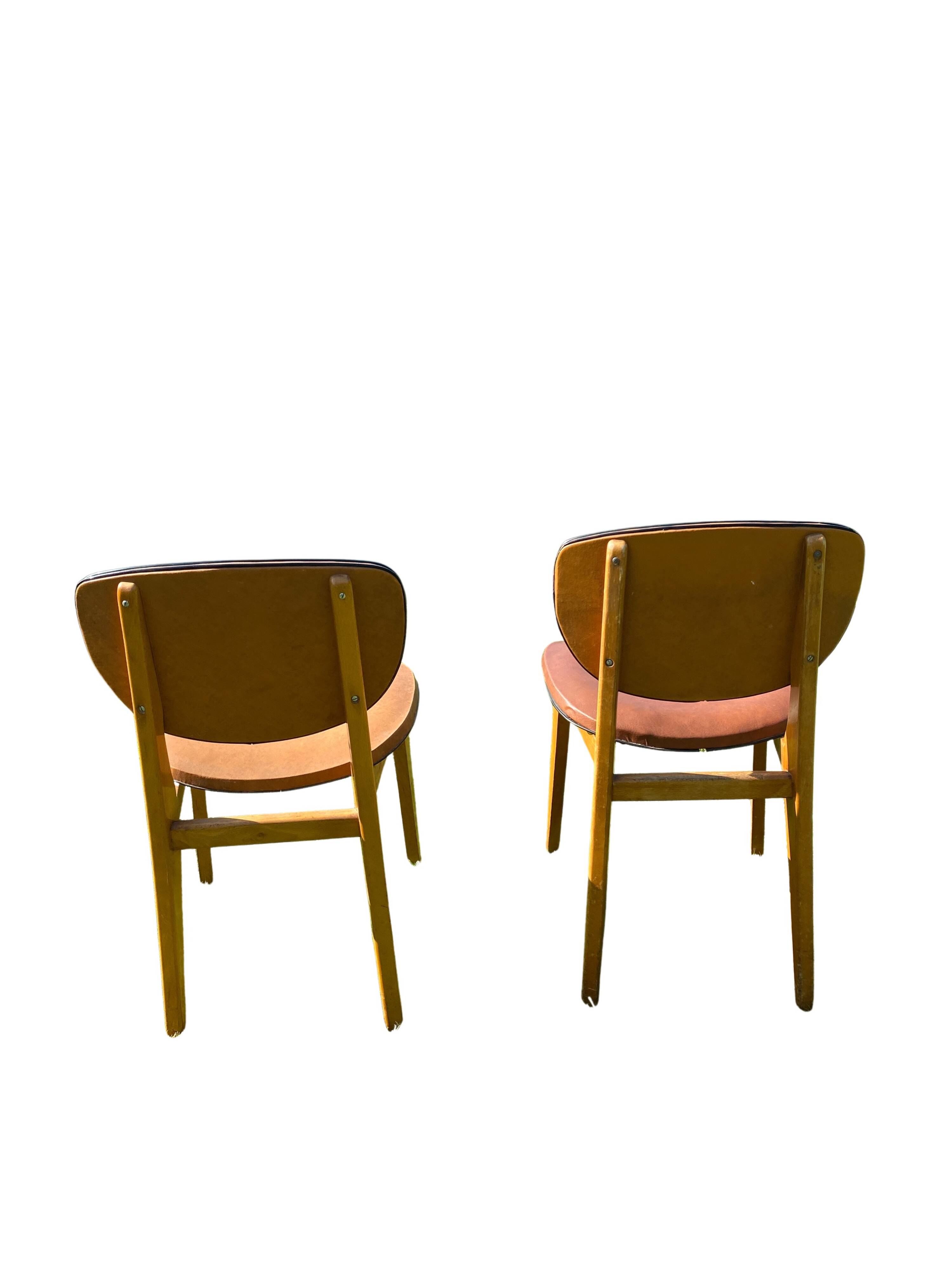 Pair of Scandinavian wood and leather chairs, Circa 1960