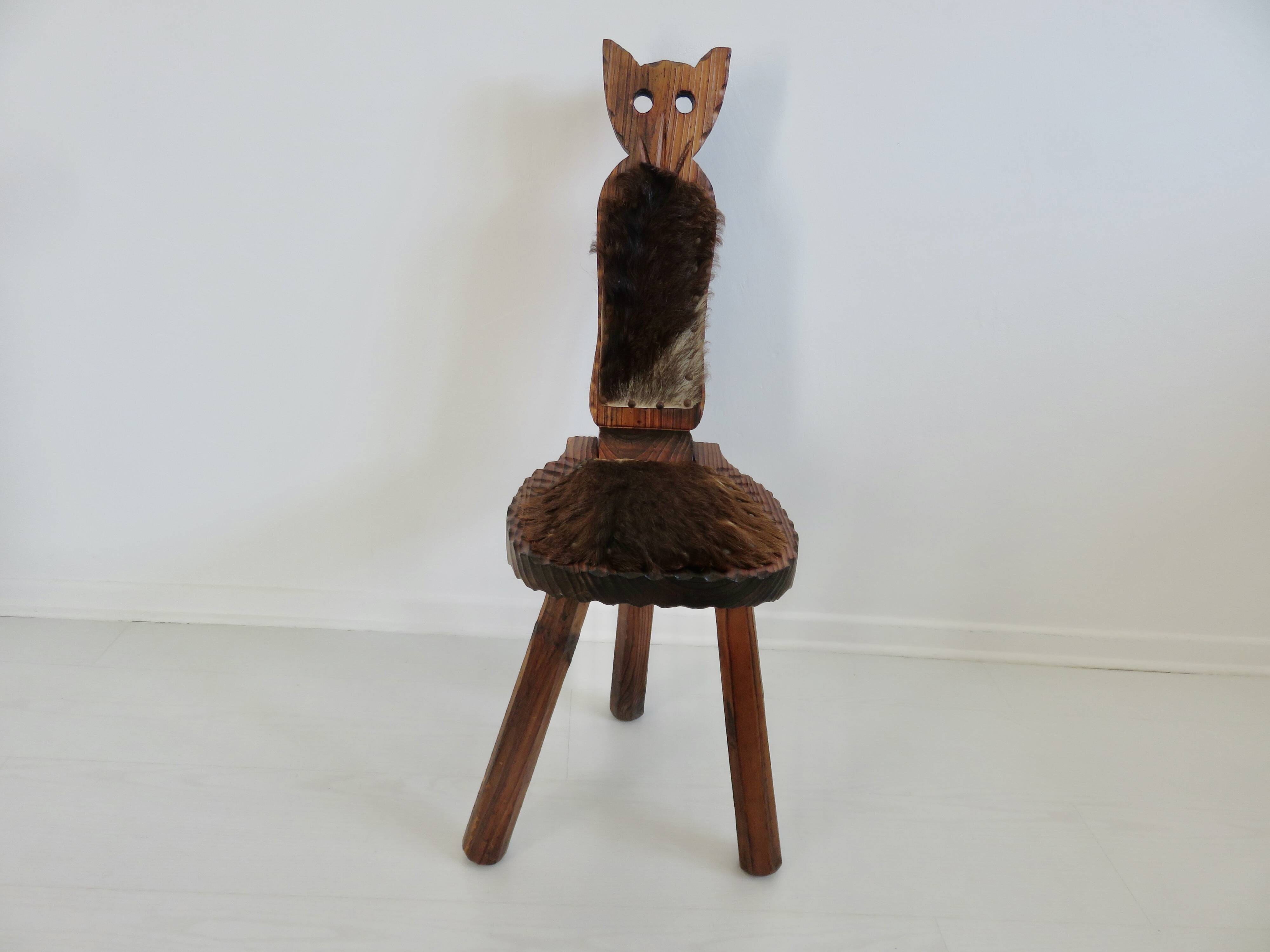 Brutalist cowhide tripod stool in solid wood