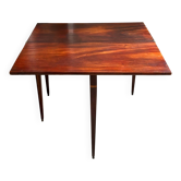 Folding table, dark wood console.