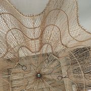 Huge rattan suspension in the shape of a corolla H:1m; D: 1m50