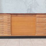 Workshop furniture with drawers and curtain in beech and walnut.