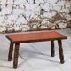 Brutalist coffee table in orange ceramic and solid wood.