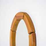 Sculptural wall-mirror in solid pine
