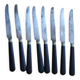 Un lot de 8 couteaux manches bois noir Viroles