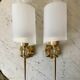 Pair of gold steel wall lamps, plexi and pleated plastic shades 60s-70s