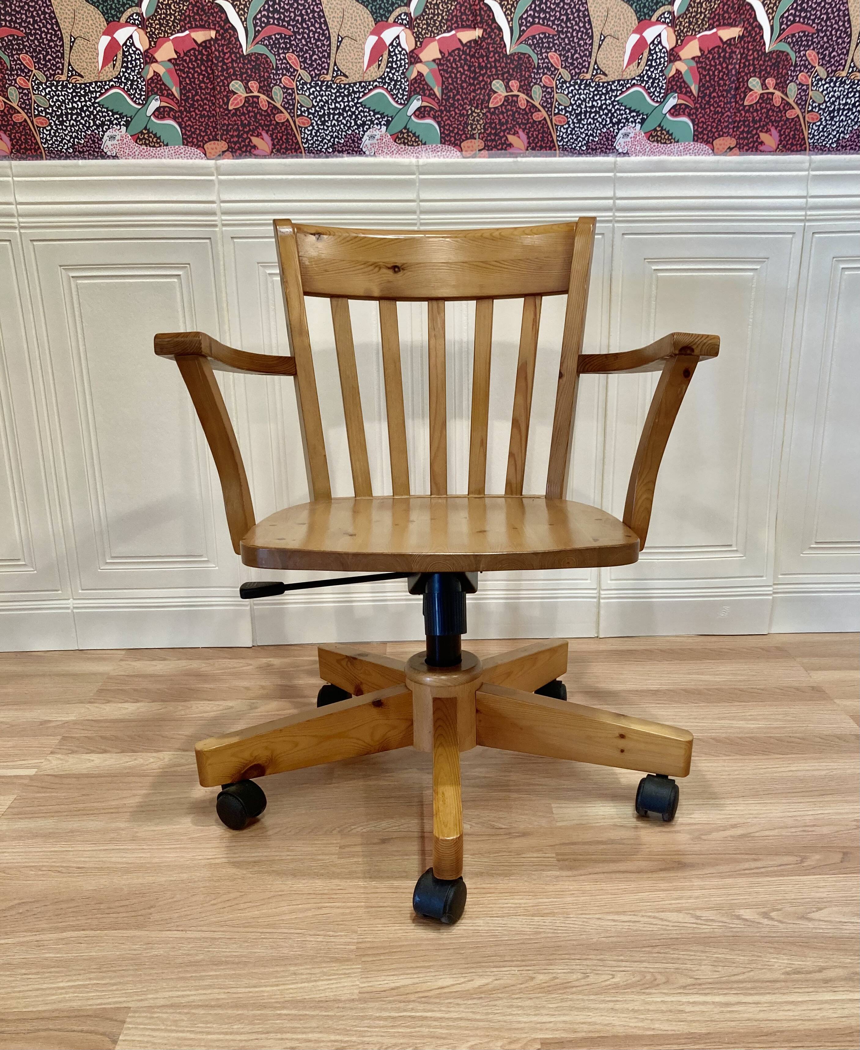 Solid wood swivel and reclining armchair.