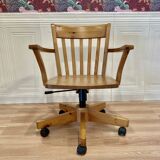 Solid wood swivel and reclining armchair.