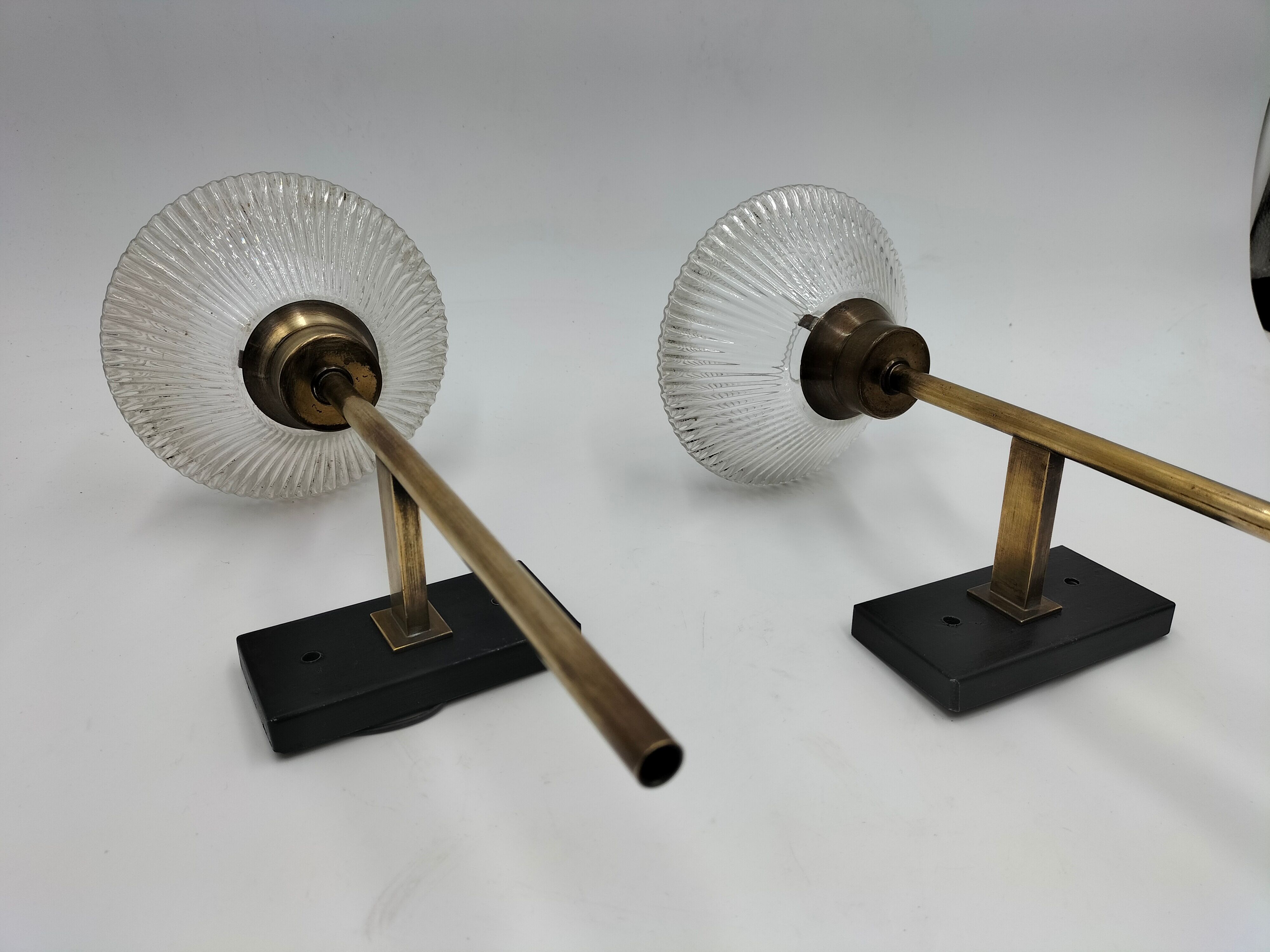 Pair of brass and glass wall lamps