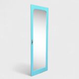 Beveled mirror on turquoise Parisian door