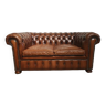 Two-seater brown leather Chesterfield sofa