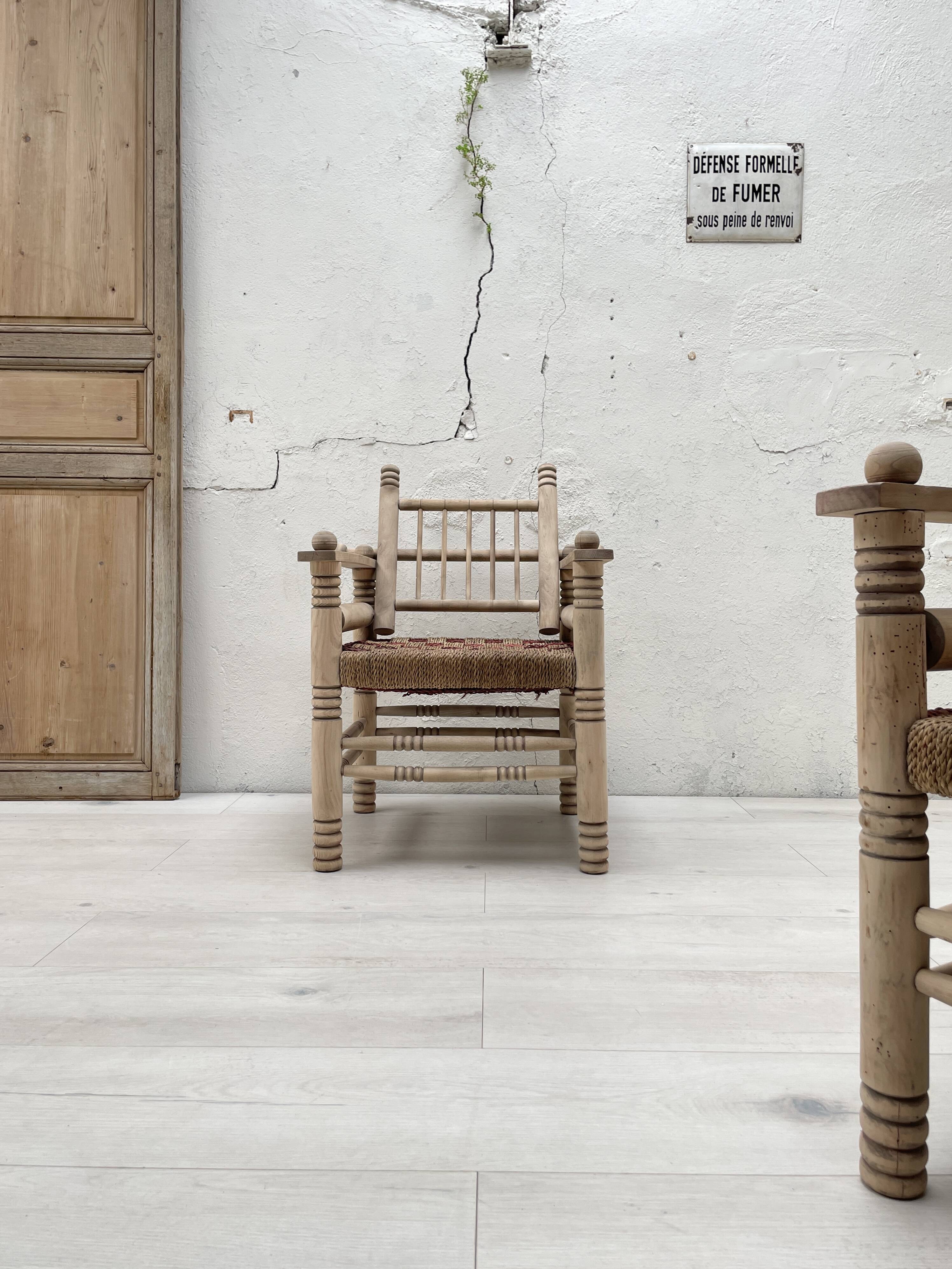Pair of wooden armchairs and ropes