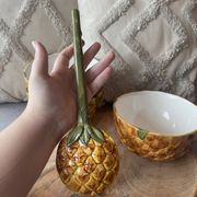 Old set of bowls and spoons in the shape of vintage pineapple