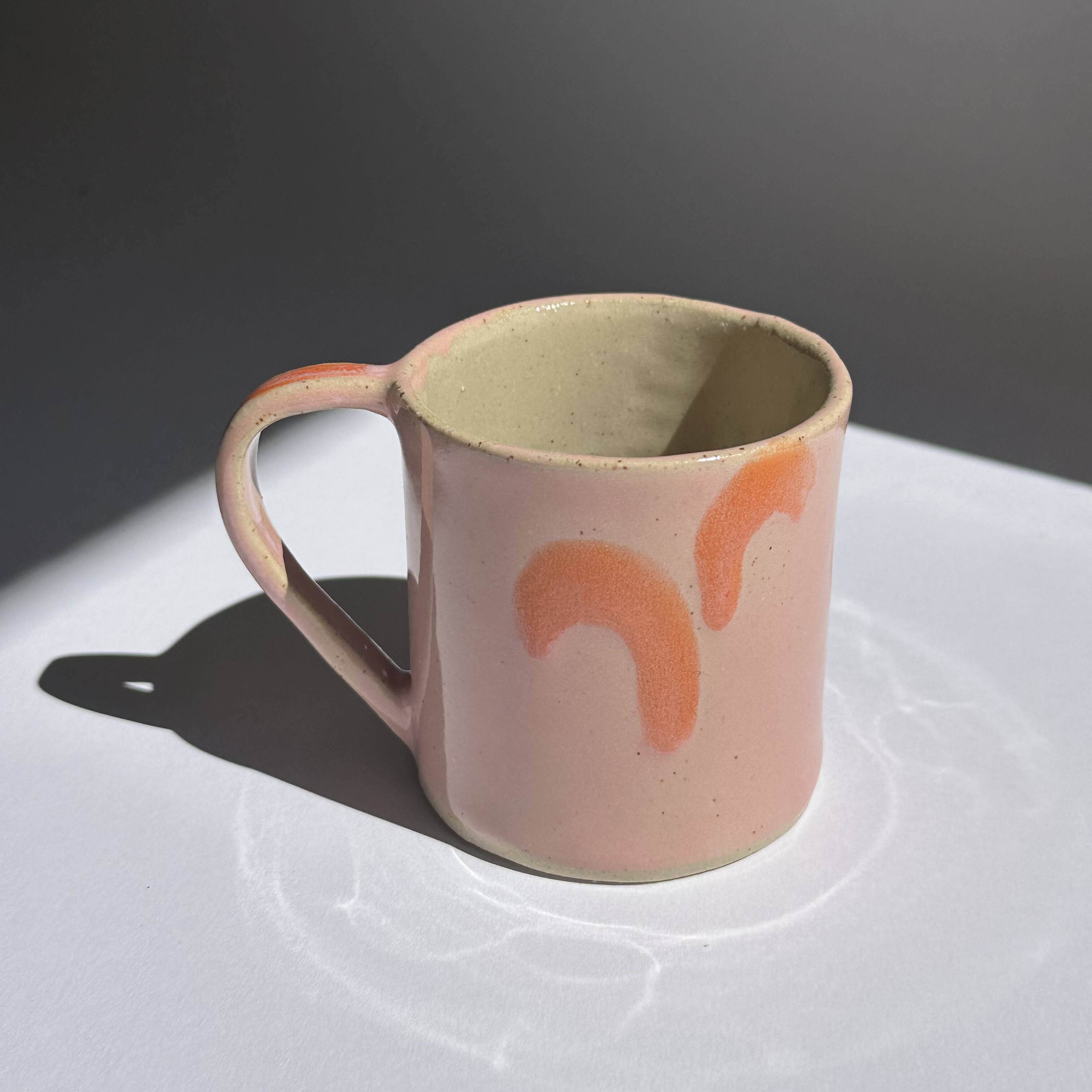 pink and orange mug