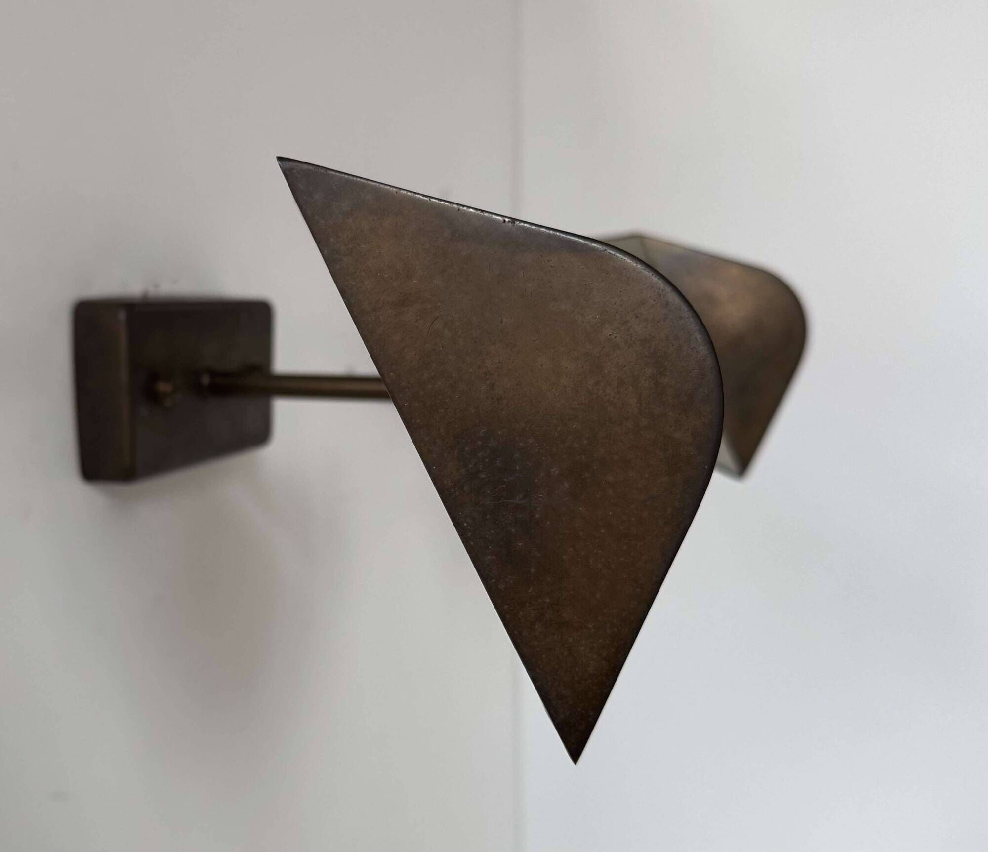 Pair of vintage adjustable wall lights, patinated brass, France 1970.