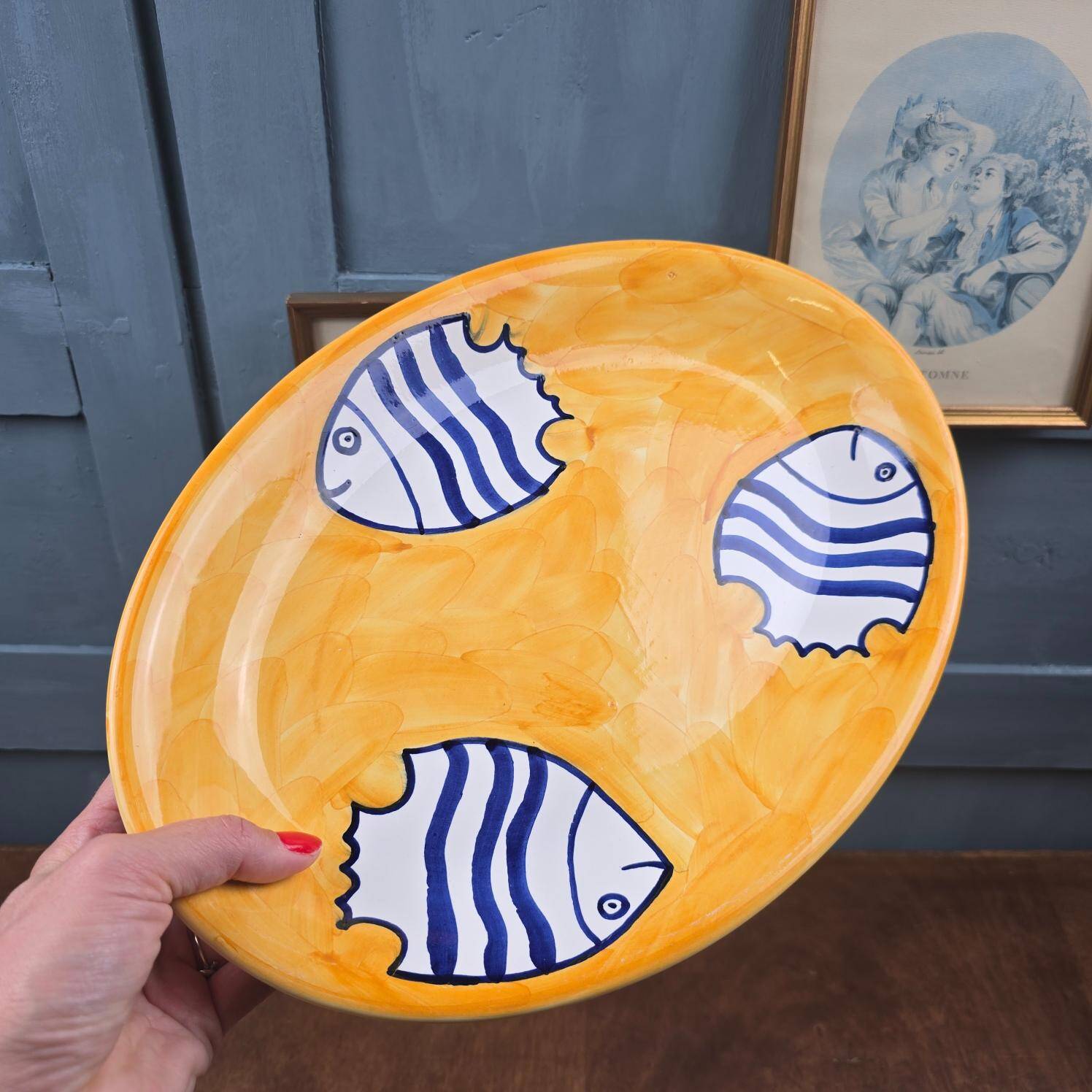 Oval dish decorated with hand-painted blue fish, Mediterranean style