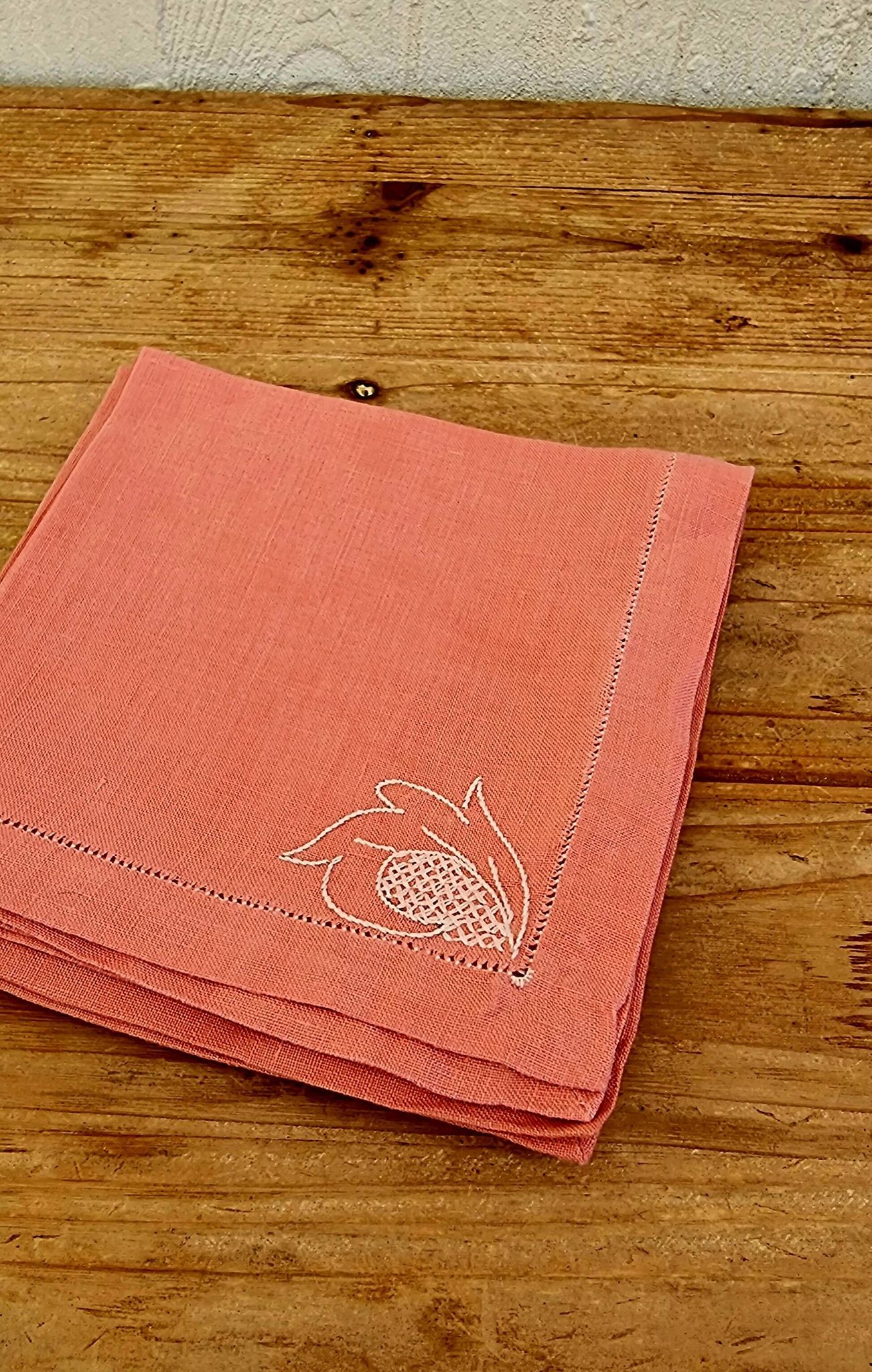 Set of 4 embroidered pink napkins.