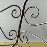 Metal doll's bed on vintage casters