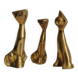 Trio of cats in gilded brass