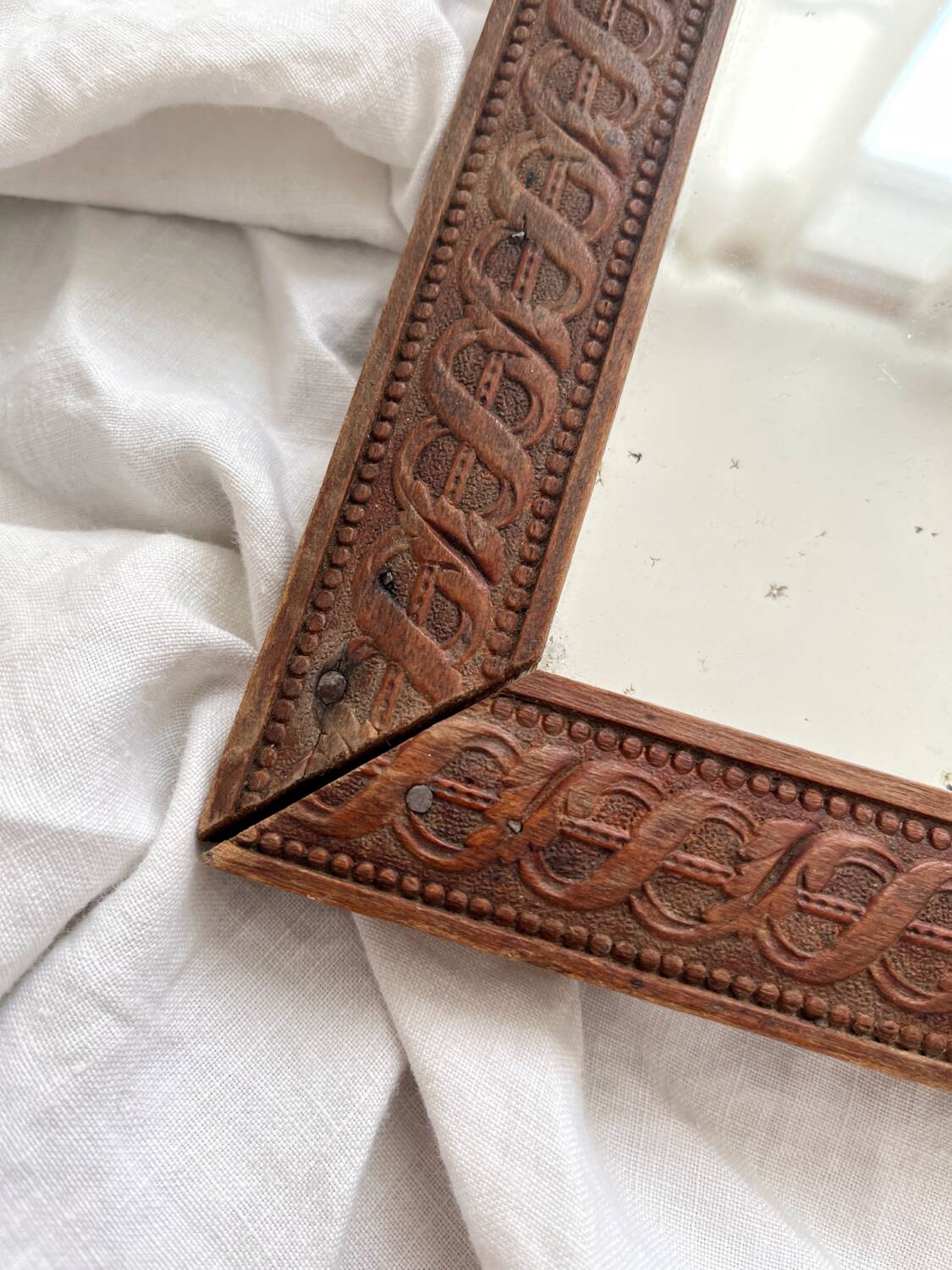 Antique mercury glass barber mirror and carved wooden frame