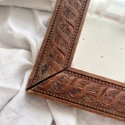 Antique mercury glass barber mirror and carved wooden frame