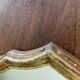 Miroir doré de style Louis XV sobre 32 X 22