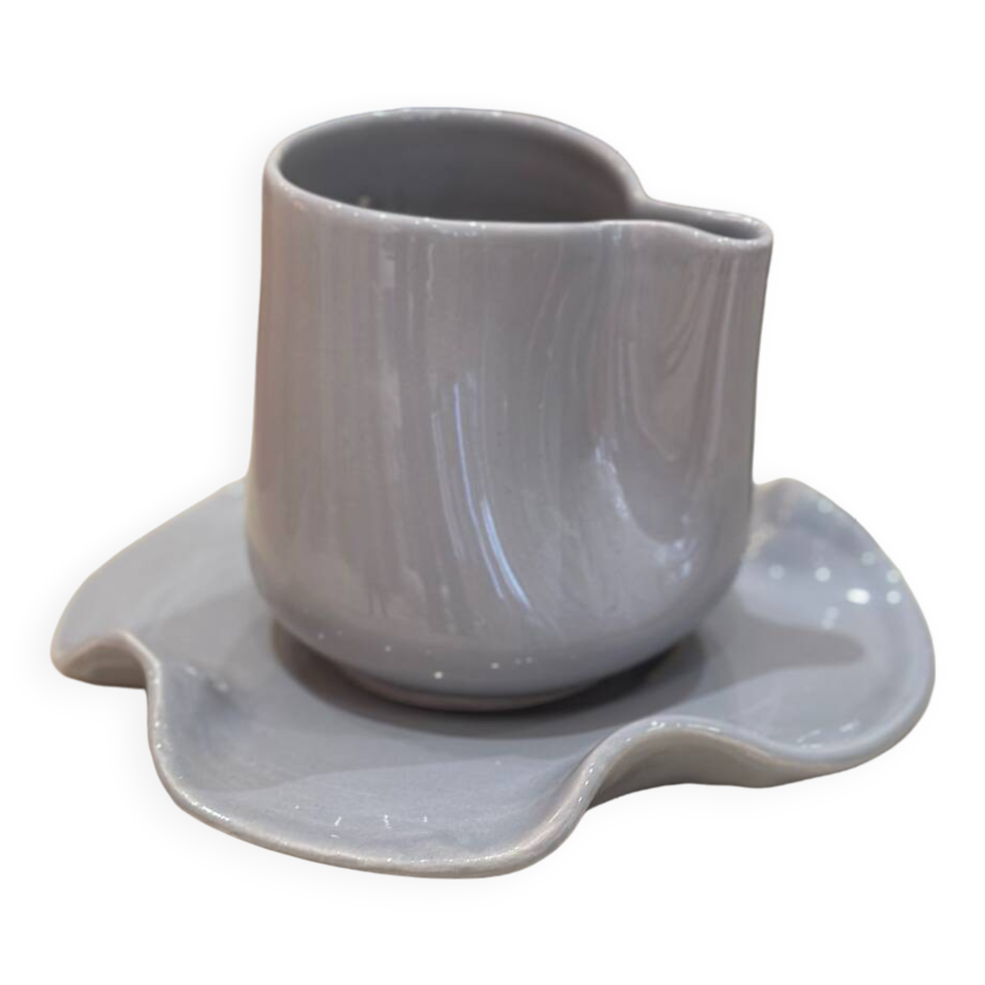 Set of ceramic artisan mugs with blue-grey pop water lily design.