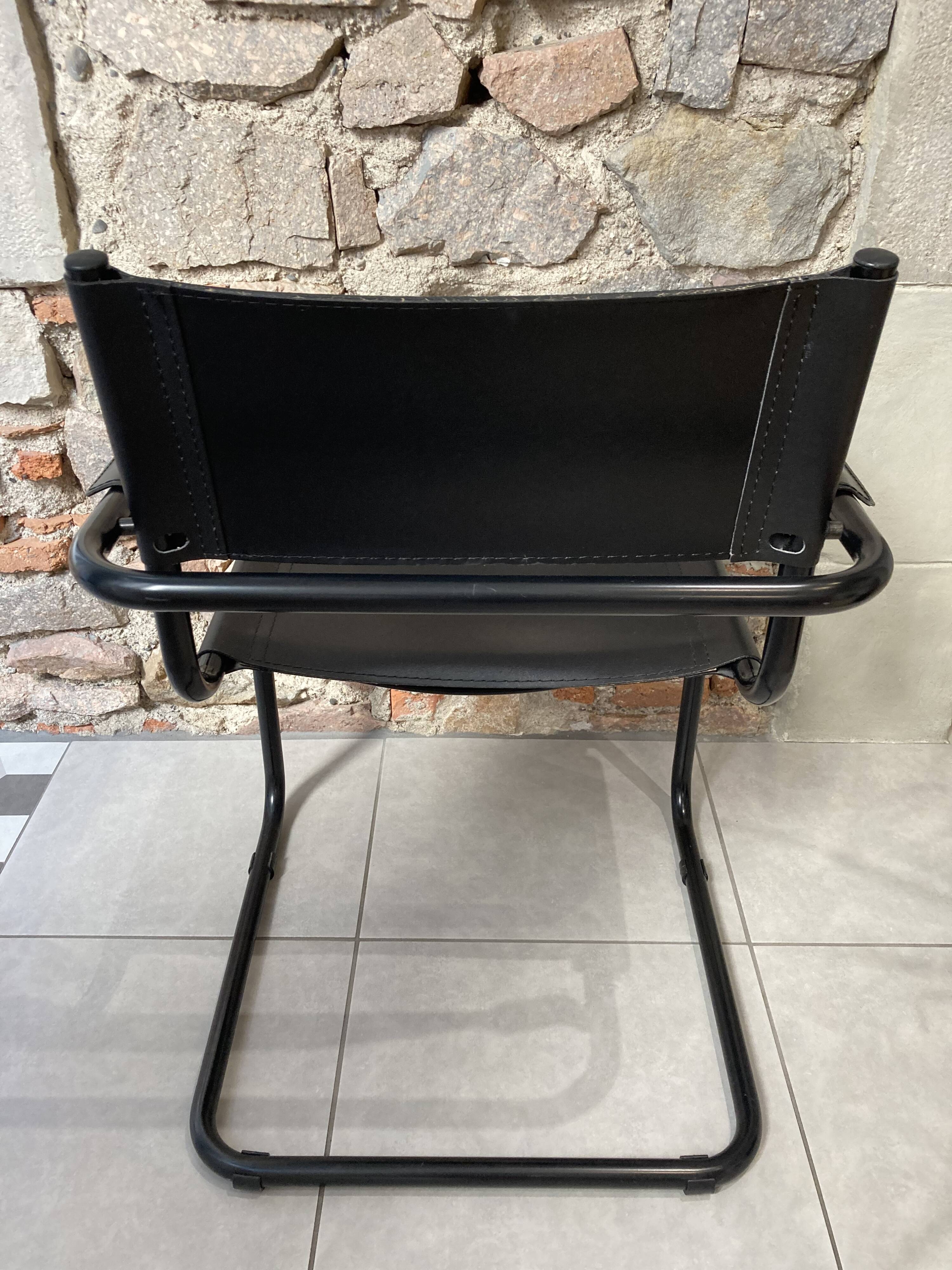 Armchair in black lacquered metal