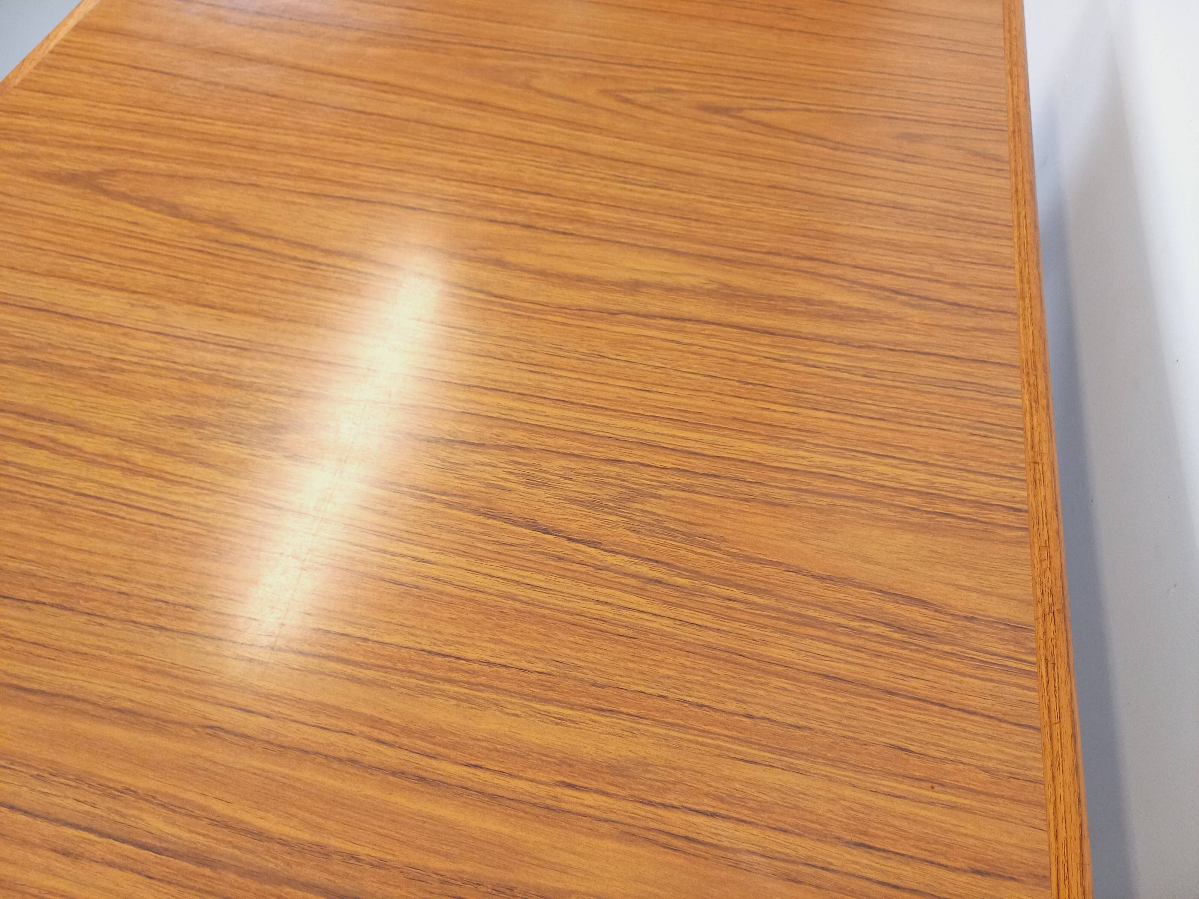 Rectangular dining table in vintage Scandinavian style made of teak and melamine.