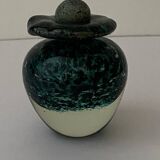 Glass bottle with silver glitter inclusions