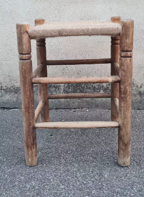 Vintage handmade wooden stool and rope