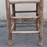 Vintage handmade wooden stool and rope