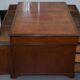 Double-sided partner's desk in walnut, George III, circa 1780, with lion head handles.
