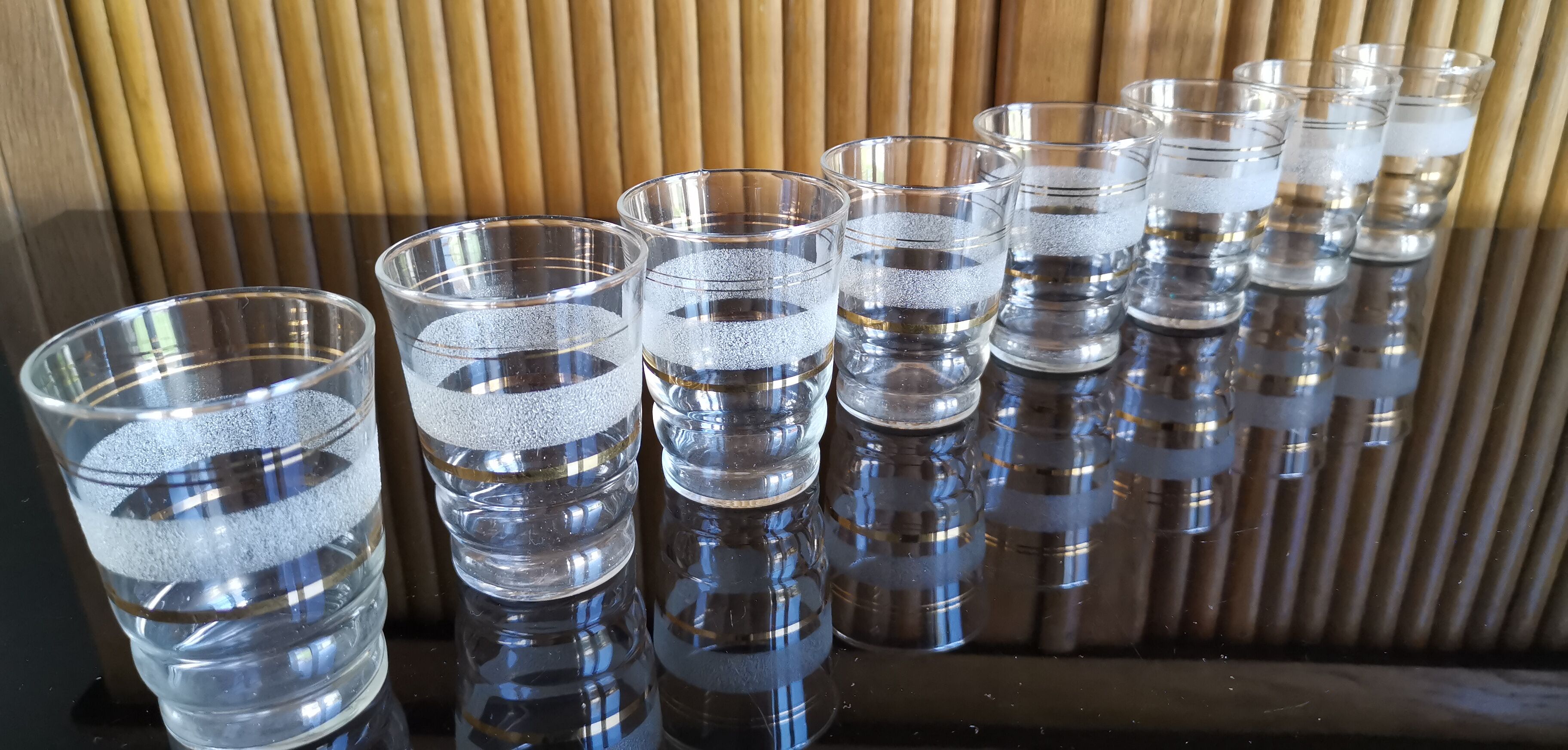 8 granite glasses bordered gold 1950s