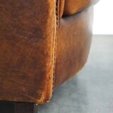 Charming and rugged sheepskin leather armchair, large model