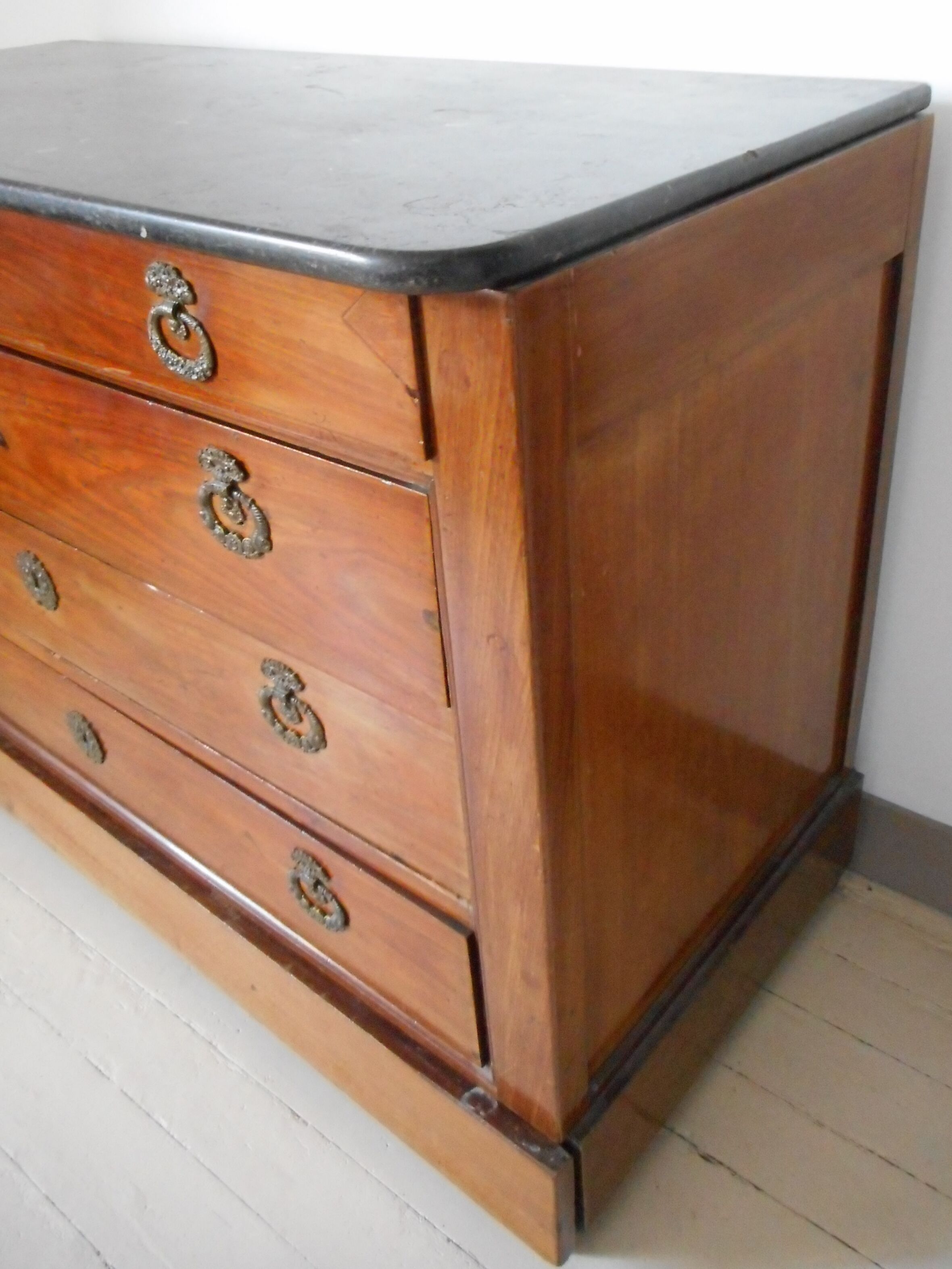 Old chest of drawers with black marble
