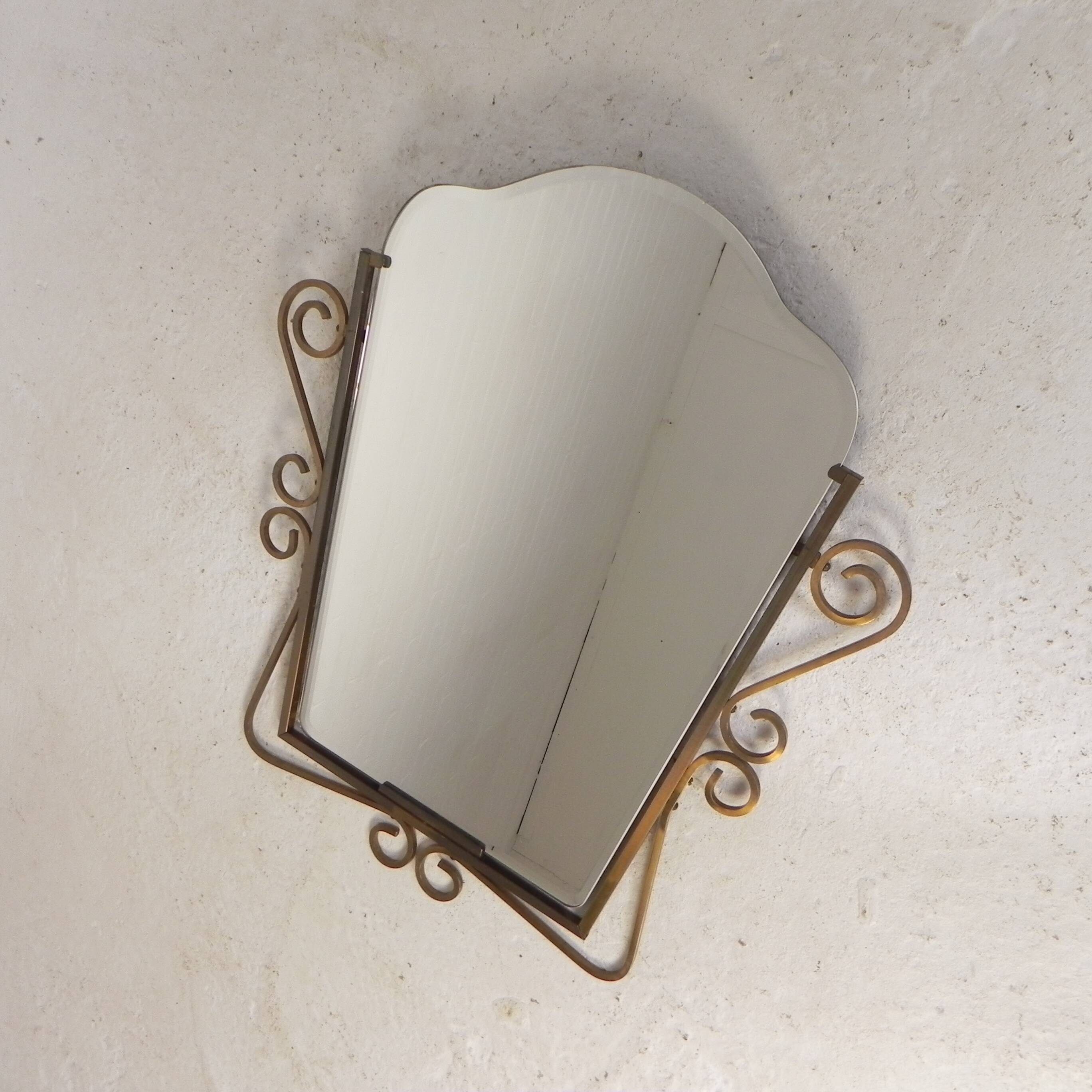 Vintage faceted mirror in a brass frame, 1950s.