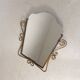 Vintage faceted mirror in a brass frame, 1950s.