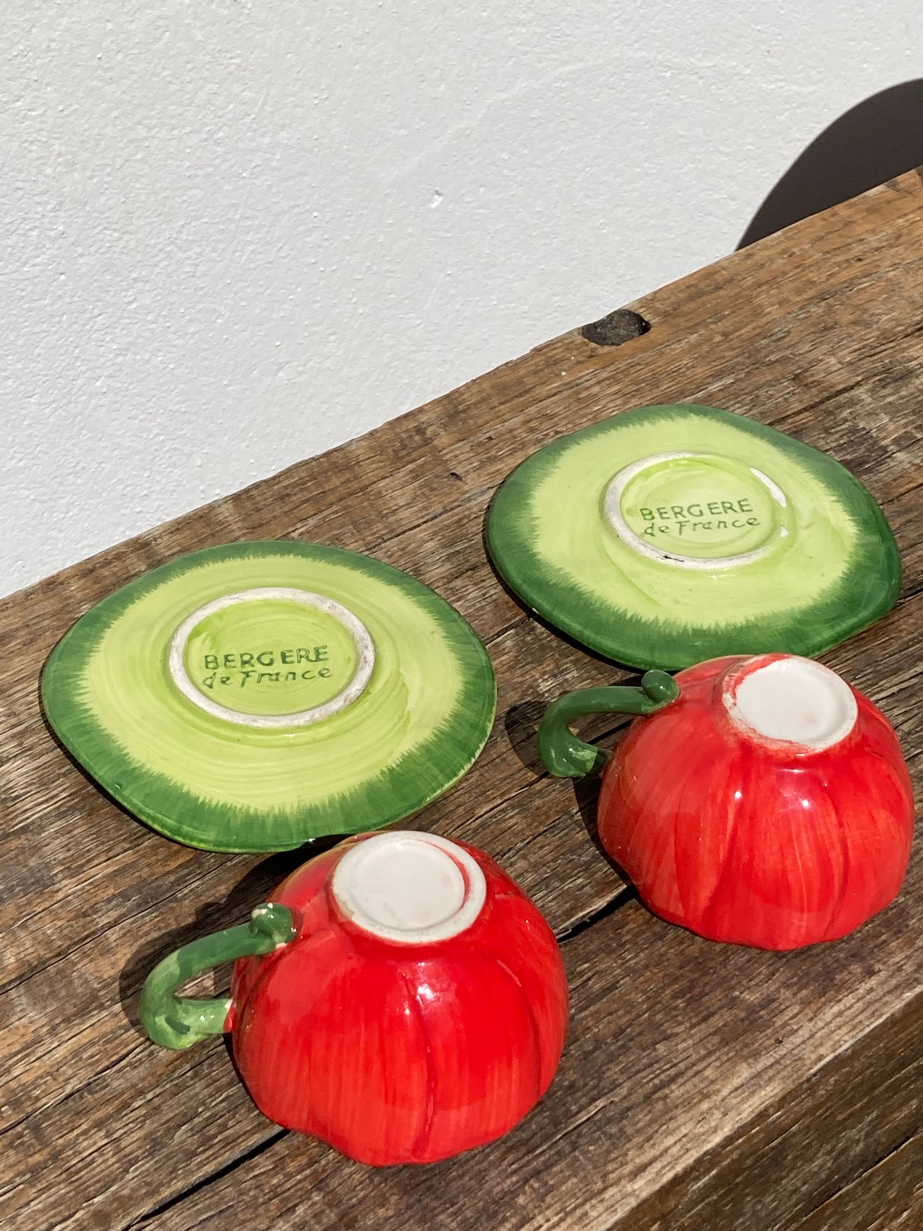 2 coffee cups red flowers and leaf in slurry shepherd