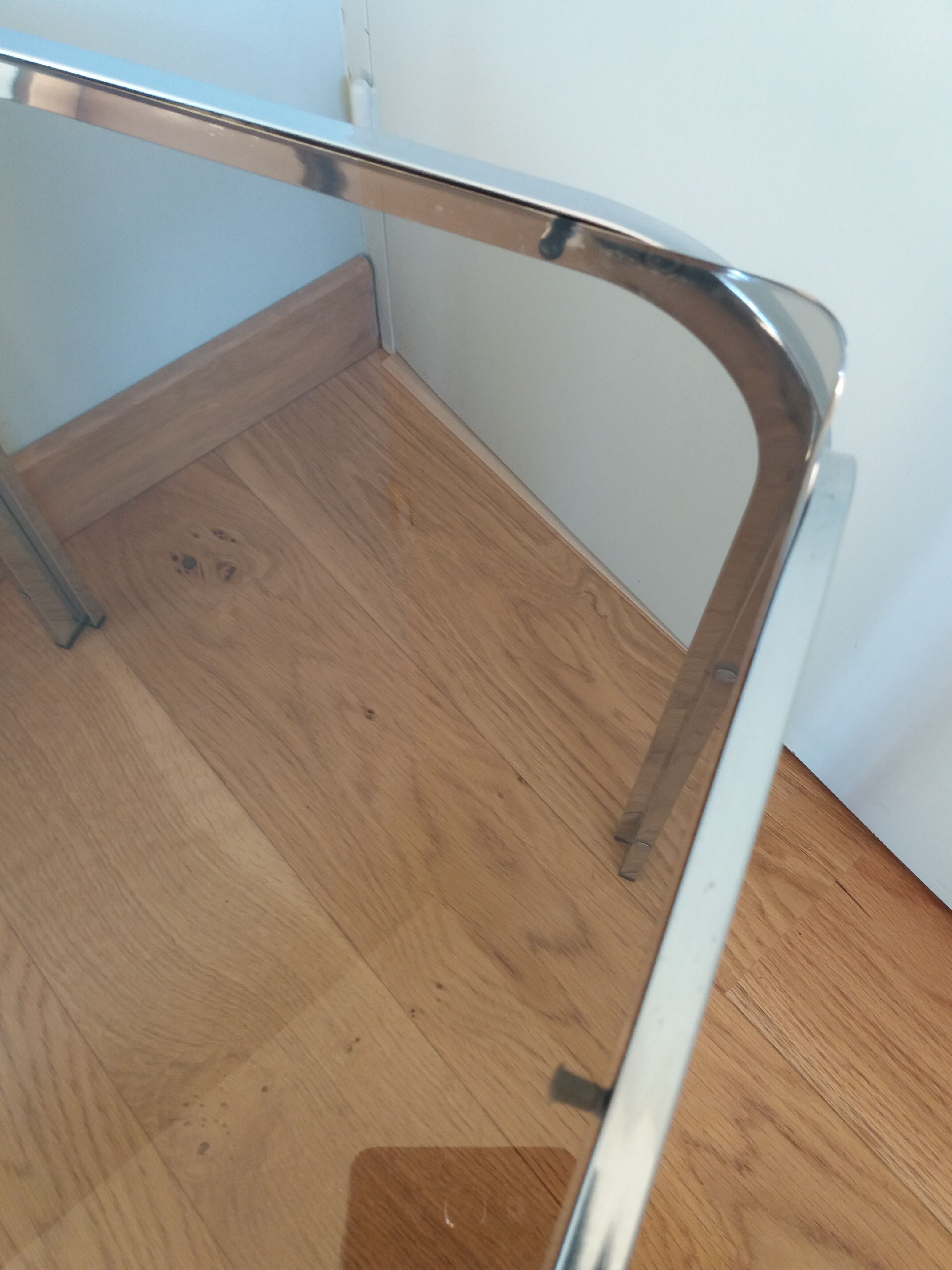 Square coffee table in chromed metal and smoked glass