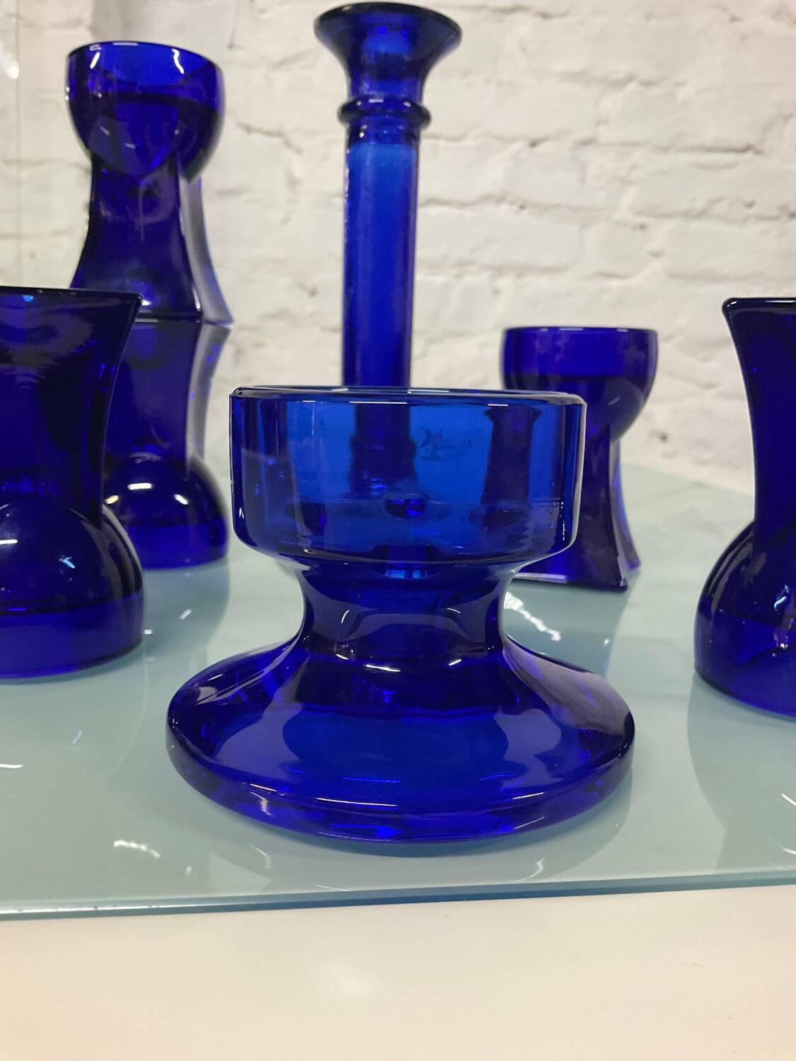 Set of 7 vintage cobalt blue glass footed candlesticks