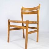 A set of four dining room chairs in oak and seat in papercord, designed by Børge Mogensen