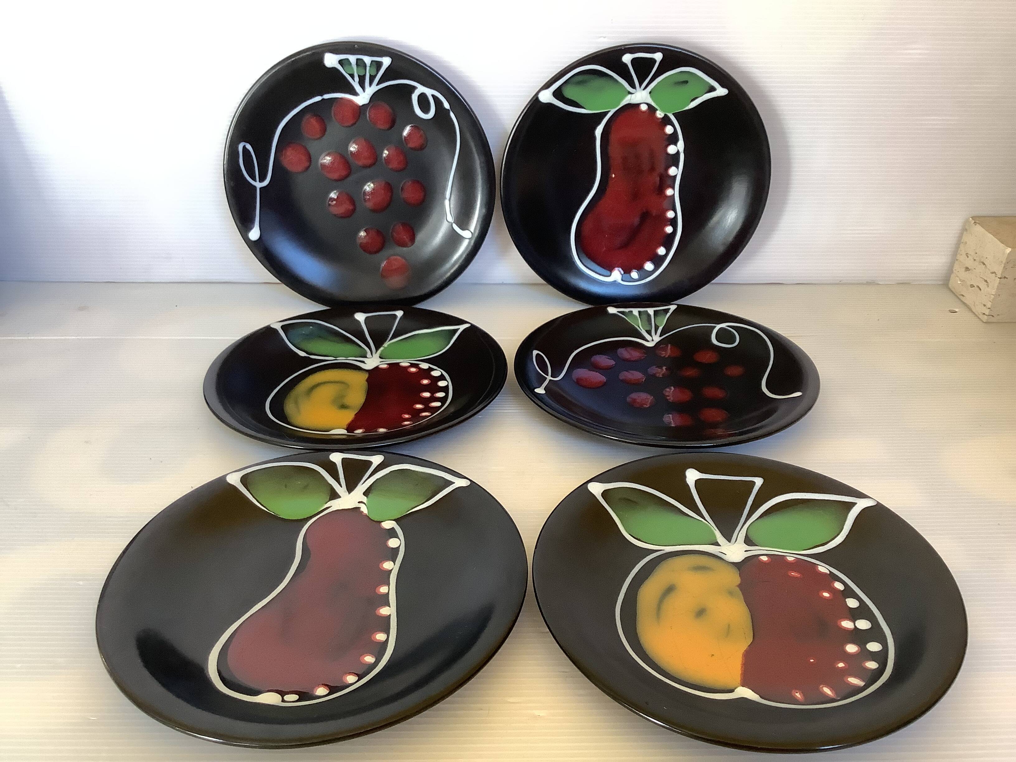 Six black glazed ceramic dessert plates
