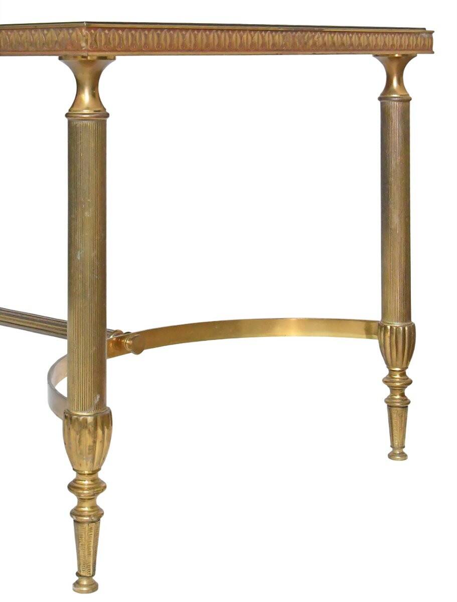 Coffee table in gilded brass with a mirrored eglomisé glass top.