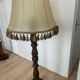 Large vintage wooden floor lamp with parchment shade and pendants.
